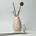 Textured Ceramic Reed Diffuser with Sola Flowers & Rattan Ball Accents